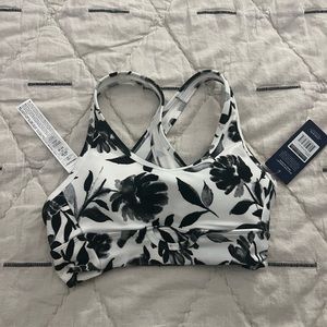 Small, black and white sports bra with tags intact